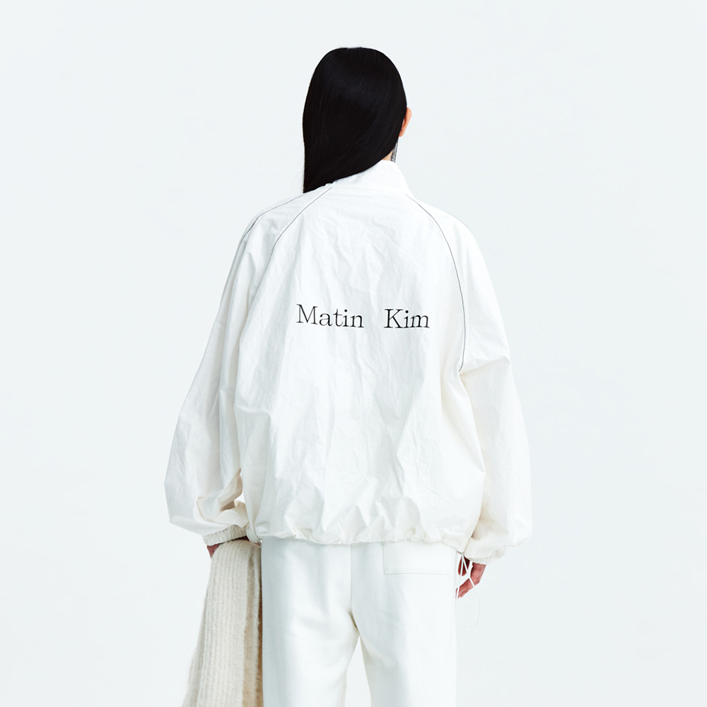 Matin Kim アイボリー ジャケット マティン・キムロゴコーティングジャンパーアイボリー