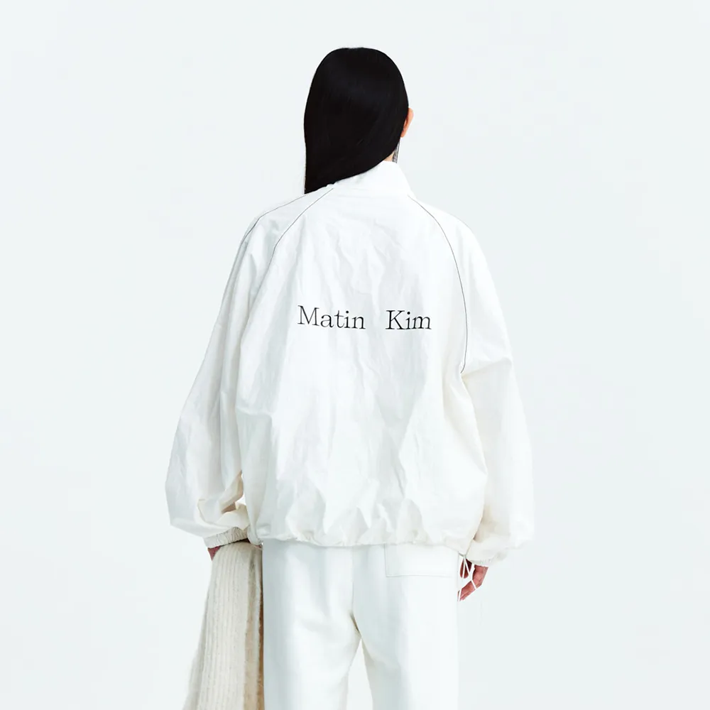 Matin Kim ASYMMETRIC LOGO KNIT PULLOVER IN IVORY main image 1